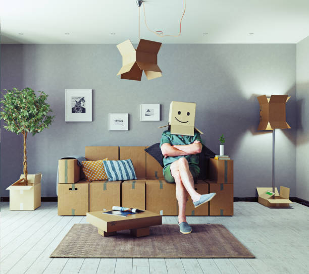 man in cardboard boxes design room The room with card cardboard boxes instead of furniture and the man with box on the head. Media mixed concept lifehack stock pictures, royalty-free photos & images