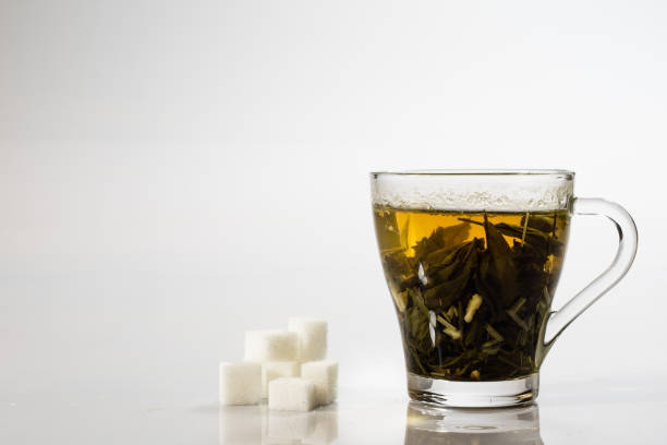 istock Tea in a glass on a white background. Green or fruit tea. 806979248