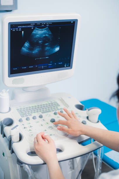 istock Hands on an ultrasound machine at modern clinic 806979332