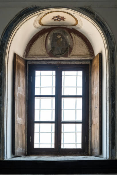 istock Church Window with a Wooden Frame and Shutters 806985720