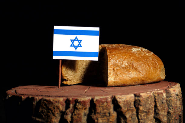 istock Israeli flag on a stump with bread isolated 806993198