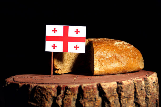 istock Georgian flag on a stump with bread isolated 806996602
