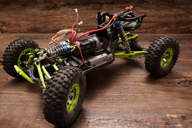 istock Rc car model toy on wooden background 806999134