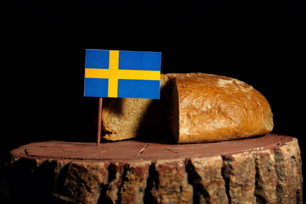 istock Swedish flag on a stump with bread isolated 807007606