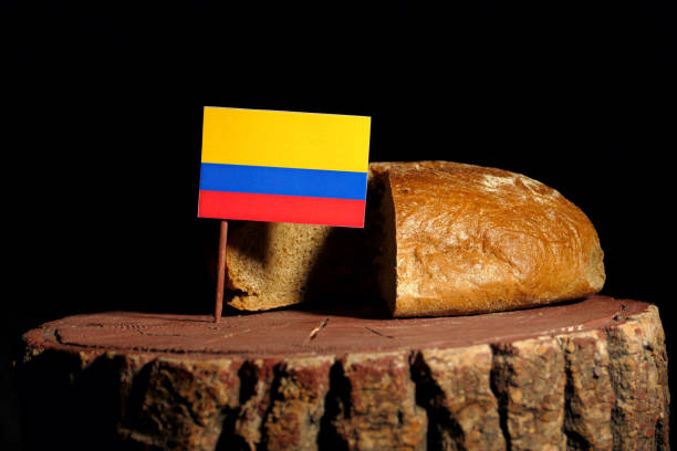 istock Colombian flag on a stump with bread isolated 807016650