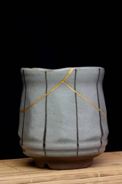 Photo of Small tea cup with kintsugi repair.