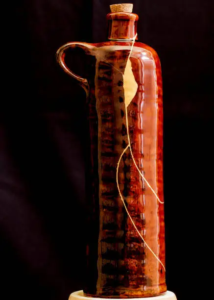 Photo of A wine bottle with kintsugi repair.