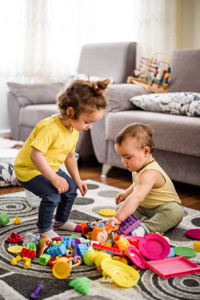 istock Cute babies playing with toys 807025252