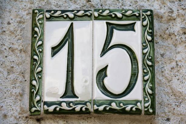 istock House number 15 at wall in Italy 807025424