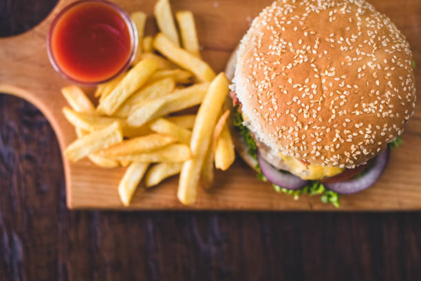 Homemade burgers on rustic wooden background