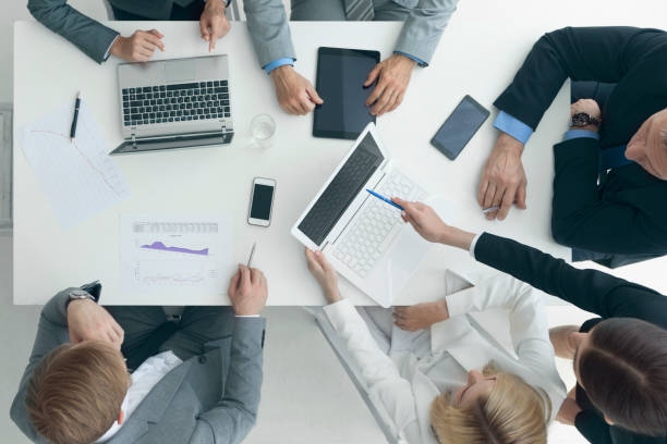 istock Business people brainstorming at office desk 807041988
