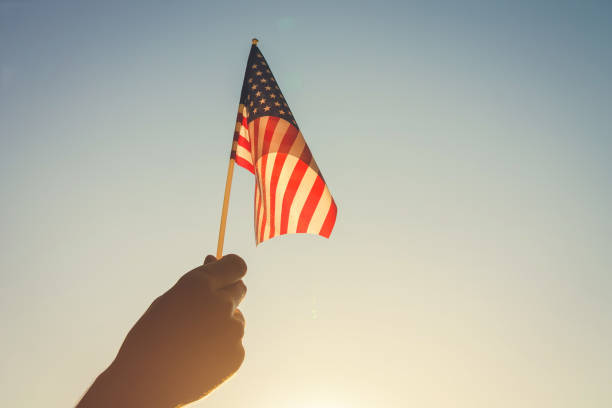 istock Man holding USA flag 807078438
