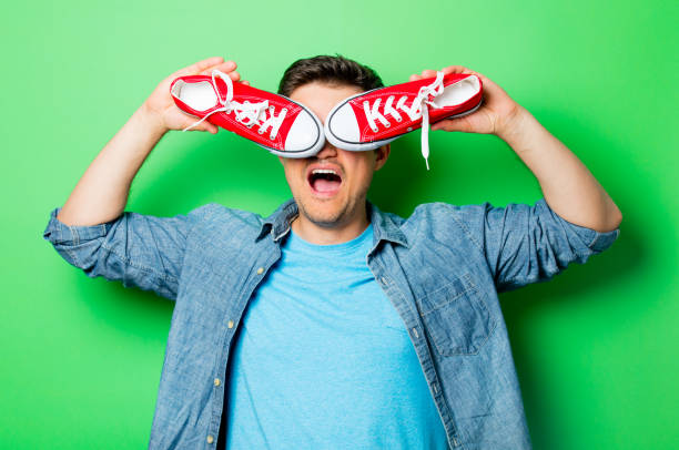 istock Handsome smiling man with red gumshoes 807104442