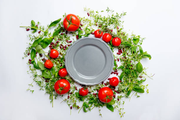 istock herbs and tomatoes near plate 807110954