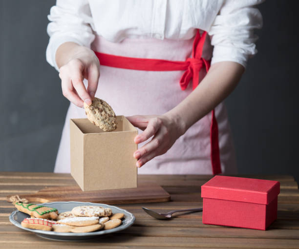 istock Housewife prepare gingerbread cookies as gift 807111020
