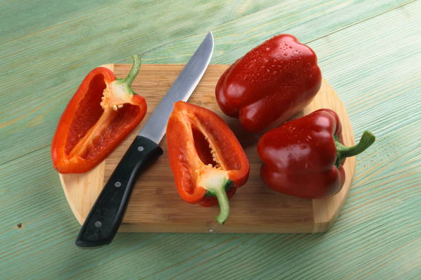 istock Red pepper on the wooden table. 807135534