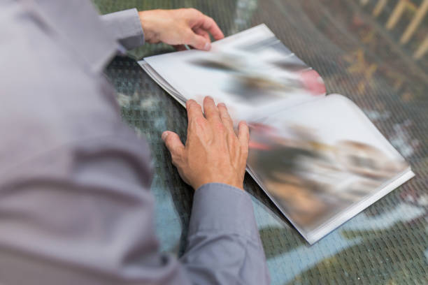 istock Men reading magazine in the outdoor 807140252