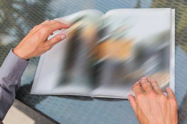 istock Adult men reading a magazine 807140260