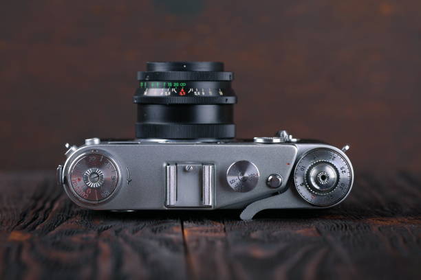 istock The old rangefinder camera on a wooden background. 807144922