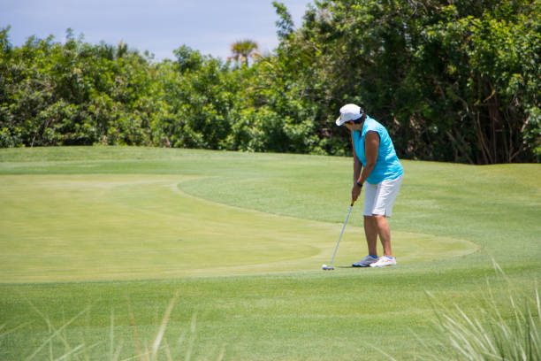 istock Golfer Putting Ball on Green 807159502