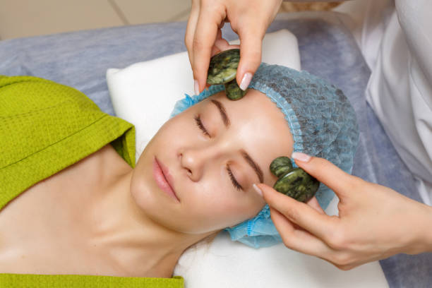 istock Spa treatment. Massage with jade stones 807171016