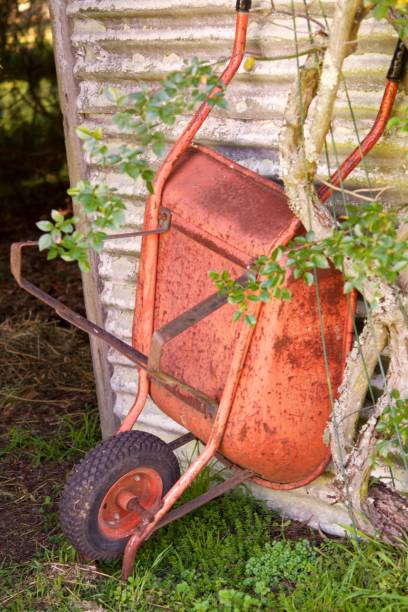Rusty red wheel barrow