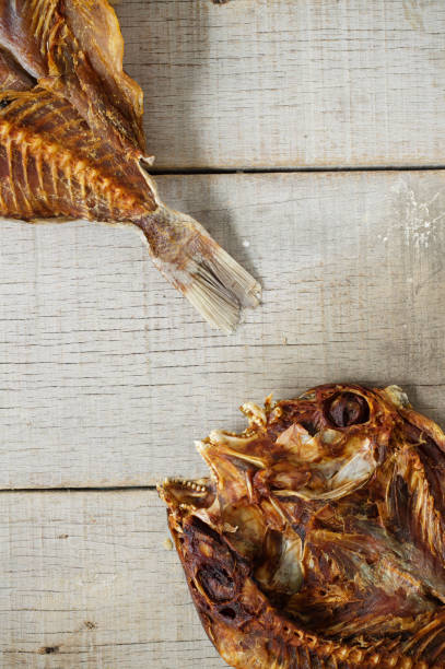 istock Dried fish on wooden. 807198548