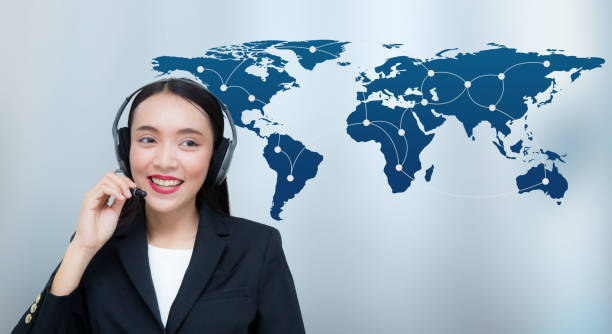 istock Beautiful asian woman smiling customer service talking on headset with world map communication. Business concept, Elements of this image furnished by NASA 807204996