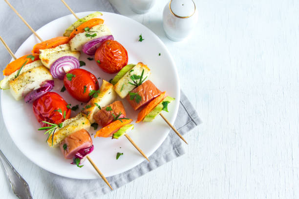 istock sausage and vegetables skewers 807207224