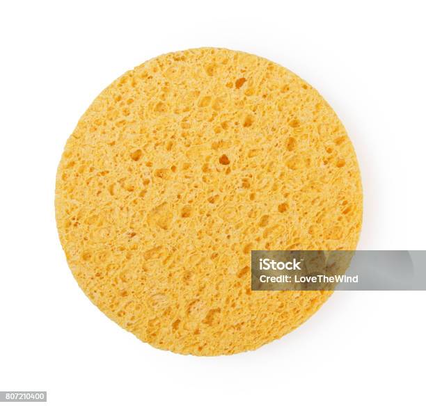 Yellow Sponge Circle Shape Cleansing Puff For Face Or Cleaning Stock Photo - Download Image Now