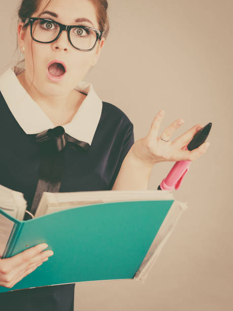istock Shocked business woman looking at documents 807210572