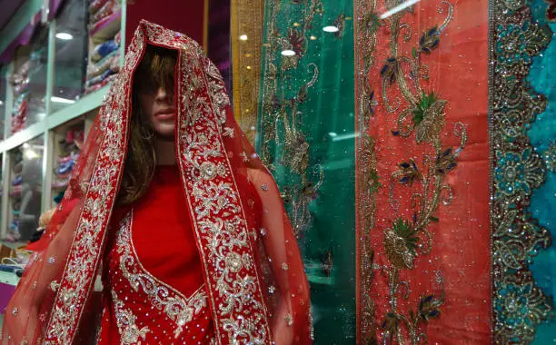 Photo of Mannequin dressed in Indian dress or saris kept in front of retail shop or stores in the market, Hyderabad,India