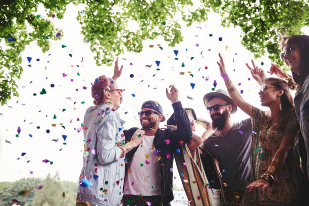 istock Group of friends dancing in confetti 807215410