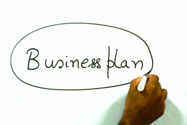 Business plan Business plan is written on whiteboard how to write a business plan stock pictures, royalty-free photos & images