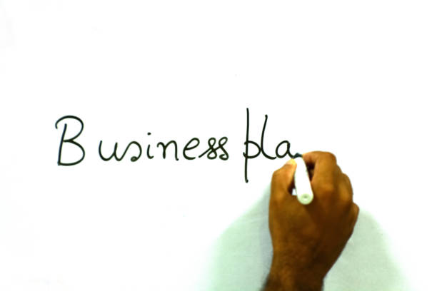 Business plan Business plan is written on whiteboard how to write a business plan stock pictures, royalty-free photos & images