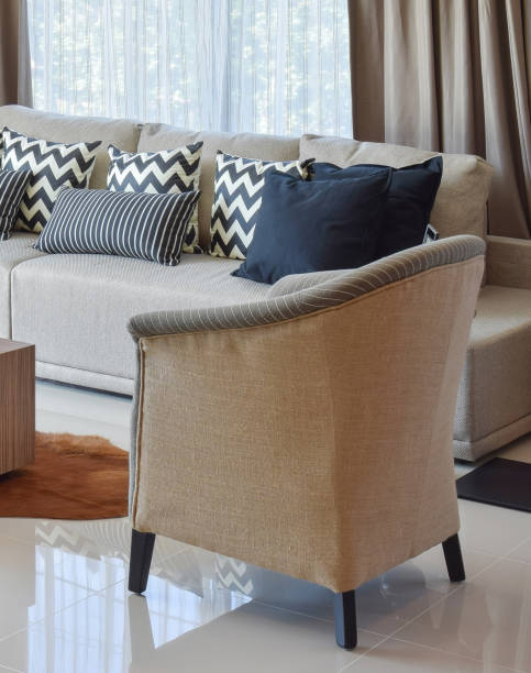 istock stylish living room design with grey striped pillows on comfortable sofa 807230360