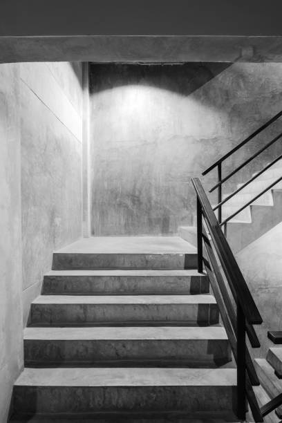 istock Empty modern rough concrete stairway with black steel handrail 807232826