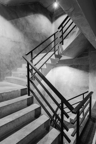 istock Empty modern rough concrete stairway with black steel handrail 807233450