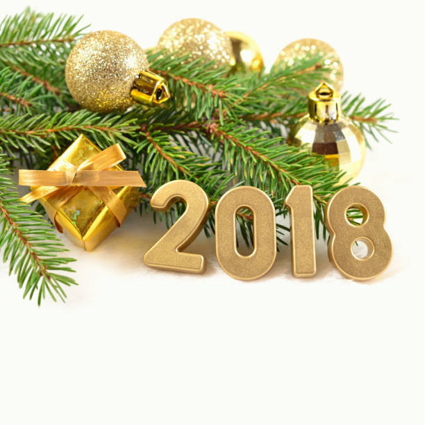 istock 2018 year golden figures and spruce branch 807236370