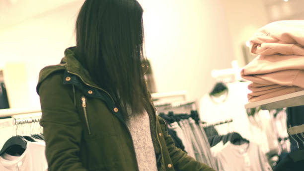 istock Woman in shop looking for clothes 807247920