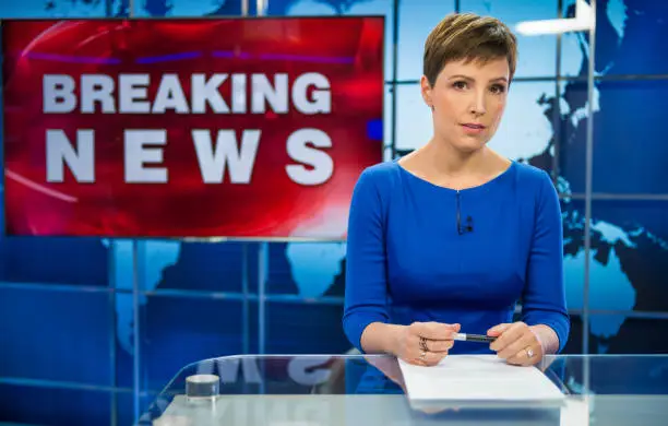 Newsreader In Television Studio