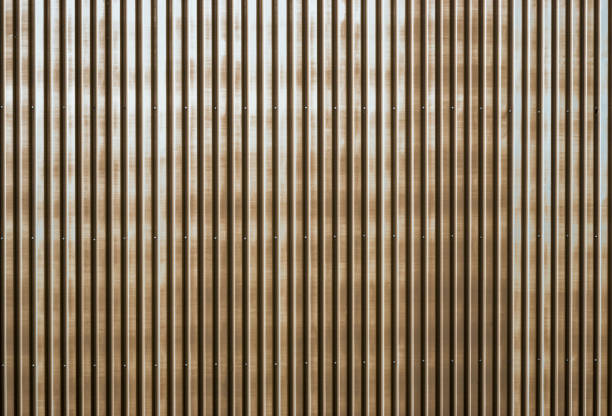 istock Old rusty corrugated metal wall of a barn building 807253684