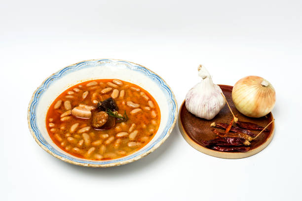 istock Stew of beans with chorizo and pork.Isolated 807256138