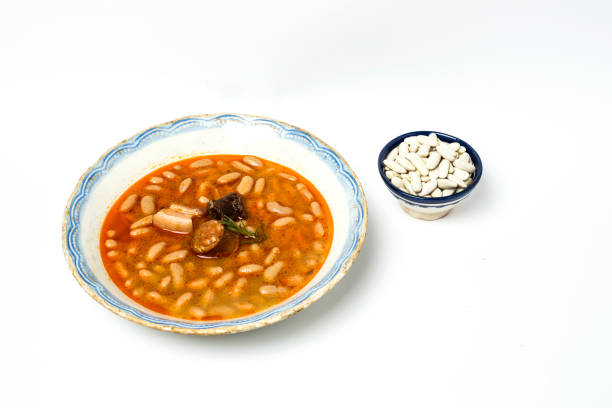 istock Stew of beans with chorizo and pork.Isolated 807256168