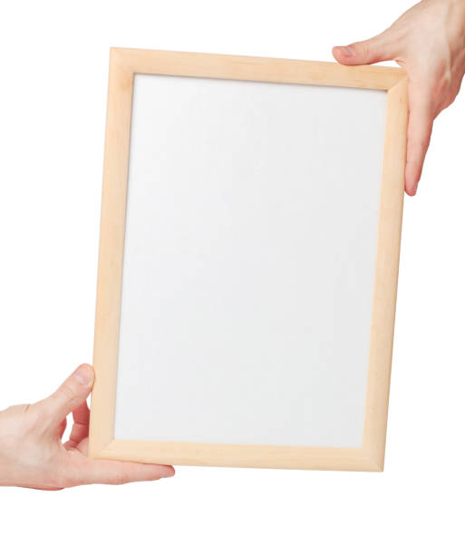 istock mockup Frame in the man hands isolated on white background 807277934