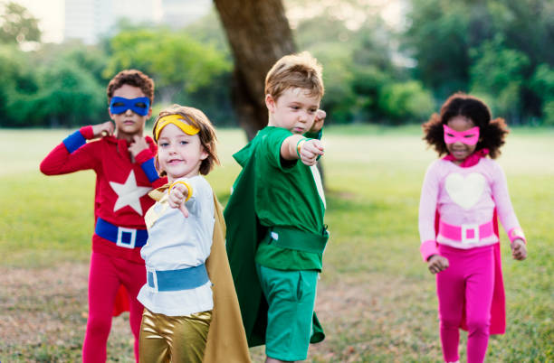 istock Superheroes Cheerful Kids Expressing Positivity Concept 807278262
