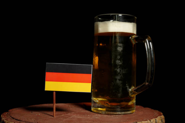 German flag with beer mug isolated on black background