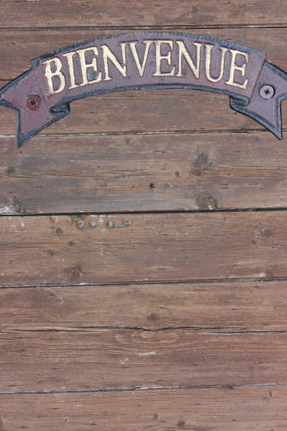 Welcome panel fixed on an old wooden door