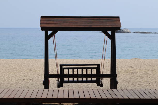 istock Swing on wood port sea background 807291932