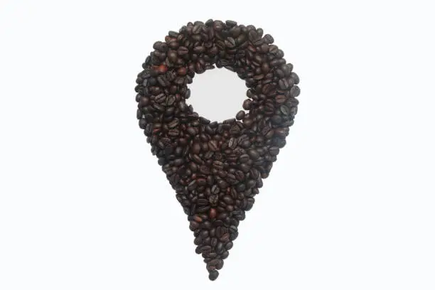 pin sign made from coffee roast beans on white background.